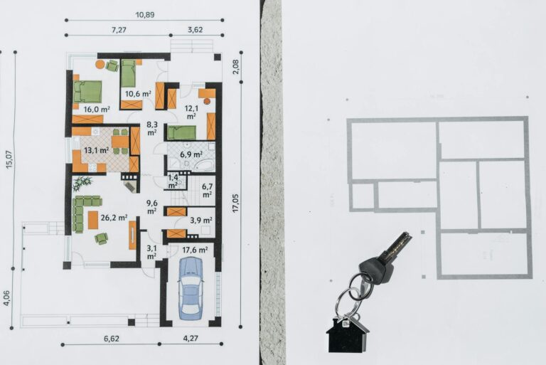 A comprehensive floor plan layout featuring a house key symbolizing real estate and homeownership.